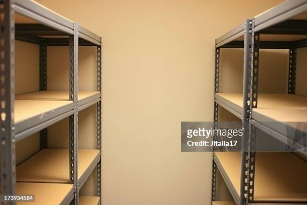 empty storage space with shelves - storage room stock pictures, royalty-free photos & images