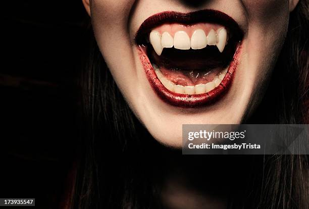vampire series - fangs woman stock pictures, royalty-free photos & images