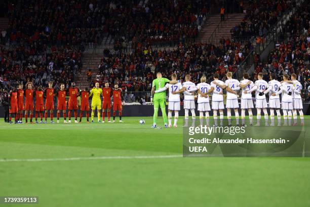 Players, fans and match officials observe a minutes silence prior to the UEFA EURO 2024 European qualifier match between Belgium and Sweden at King...