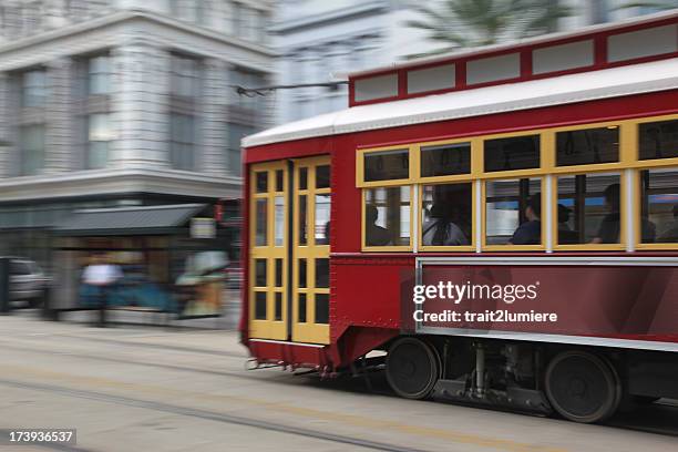 trolley in the streets of new orleans - new orleans streetcar stock pictures, royalty-free photos & images