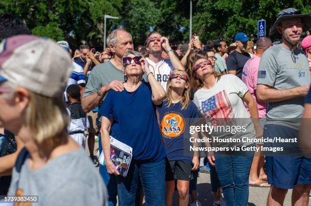 People gather to view the eclipse during the Space Center Houston Annular Eclipse Celebration and viewing event at NASAs John Space Center Saturday,...