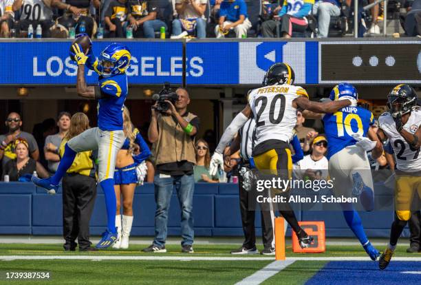 Inglewood, CA Rams wide receiver Tutu Atwell, left, catches a second quarter pass and ran it in for a touchdown past Steelers cornerbacks Patrick...