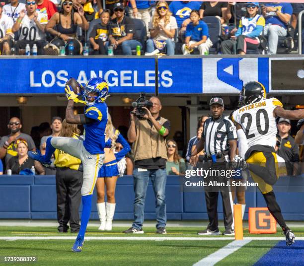 Inglewood, CA Rams wide receiver Tutu Atwell, left, catches a second quarter pass and ran it in for a touchdown past Steelers cornerbacks Patrick...