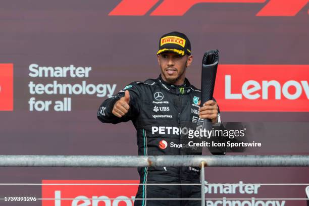 Mercedes AMG Petronas F1 Team driver Lewis Hamilton of the United Kingdom gives a thumbs up to the crowd after finishing in second place at the...