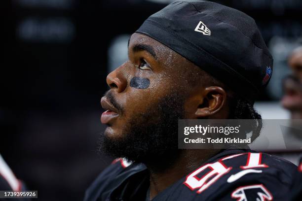 Grady Jarrett of the Atlanta Falcons looks up from the bench during the first quarter against the Washington Commanders at Mercedes-Benz Stadium on...