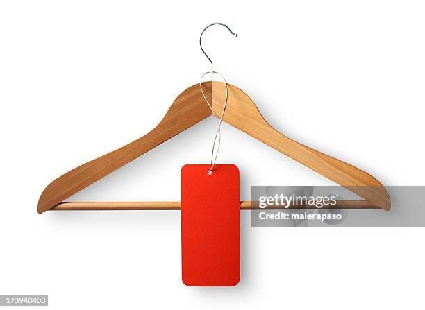 appendiabiti. - clothes hanging on rack at store for sale foto e immagini stock