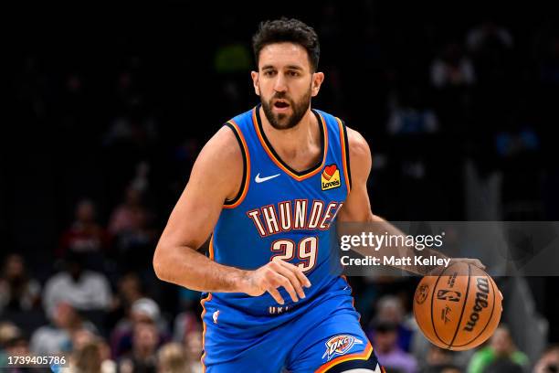 Vasilije Micic of the Oklahoma City Thunder brings the ball up court during the second half of his game against the Charlotte Hornets at Spectrum...
