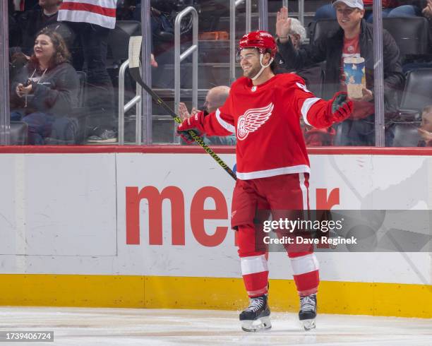 Alex DeBrincat of the Detroit Red Wings celebrates a goal against the Calgary Flames during the first period at Little Caesars Arena on October 22,...