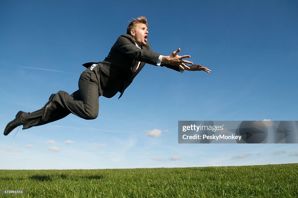 Businessman Goes for a Flying Save Green Meadow