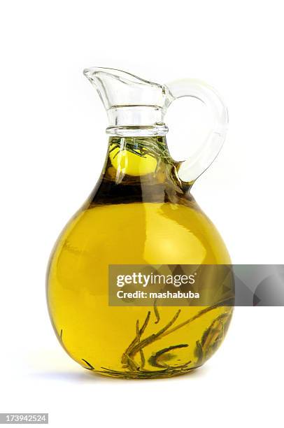 pitcher of olive oil with rosemary - olijfolie stockfoto's en -beelden