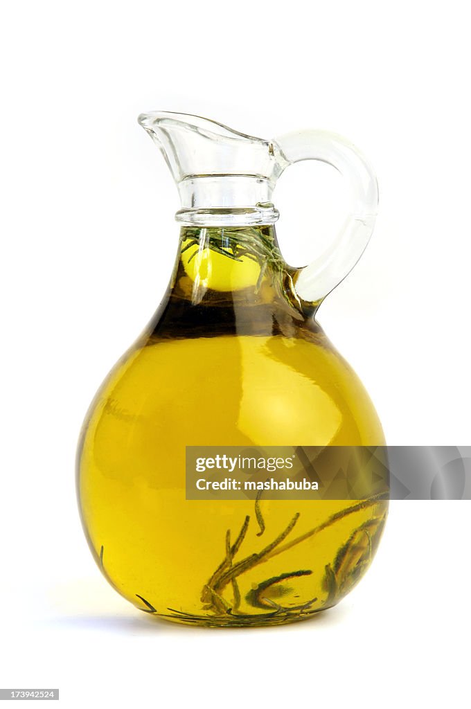 Pitcher of olive oil with rosemary