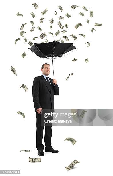 businessman under the money rain - debt collector stock pictures, royalty-free photos & images