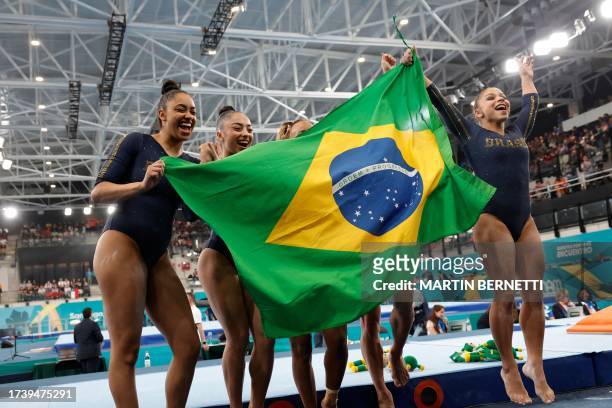 Brazil's Carolyne Pedro, Flavia Saraiva, Jade Barbosa, Julia Soares and Rebeca Andrade celebrate winning the silver medal of the artistic gymnastics...