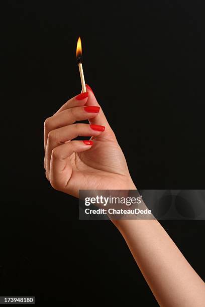 holding match - match lighting equipment stock pictures, royalty-free photos & images