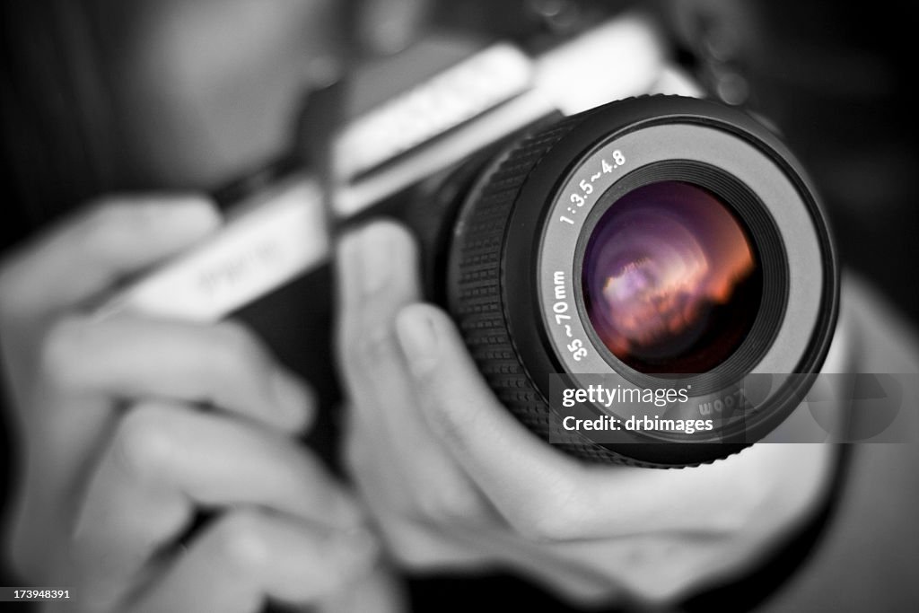 Person holds camera