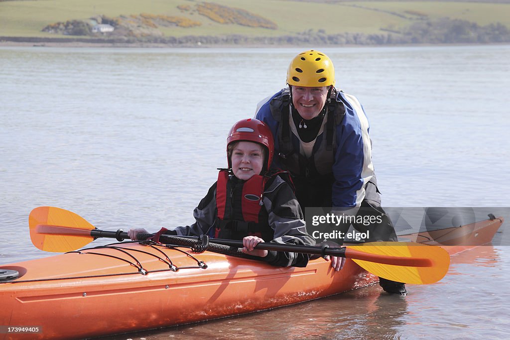 Father and son with sea kayak