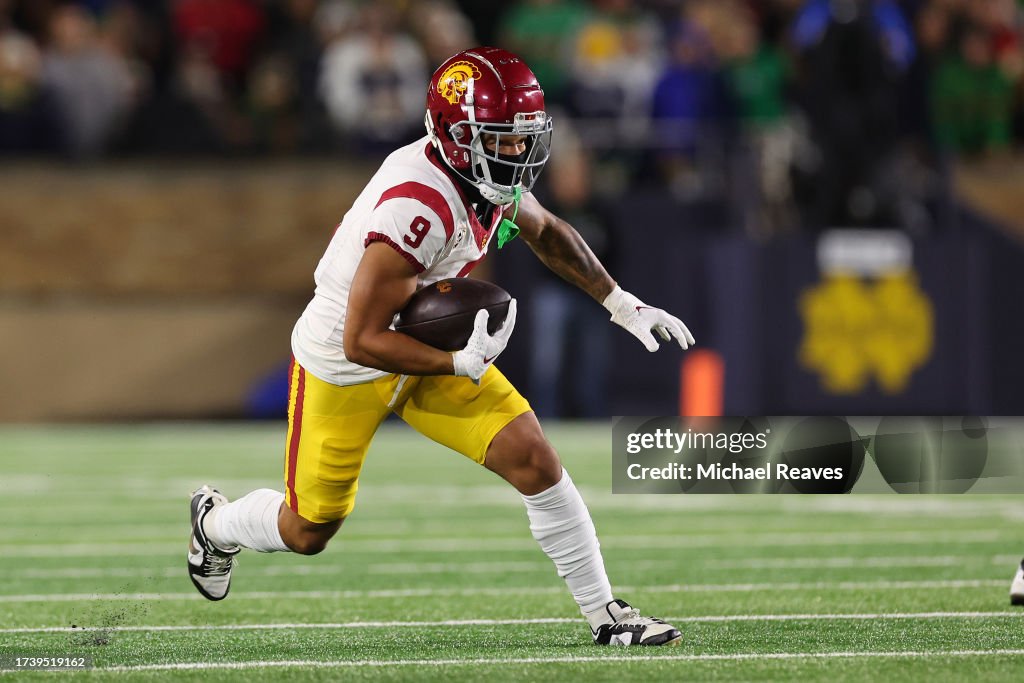 Mike Rae Usc Michael Jackson III of the USC Trojans runs with the ball against the ...