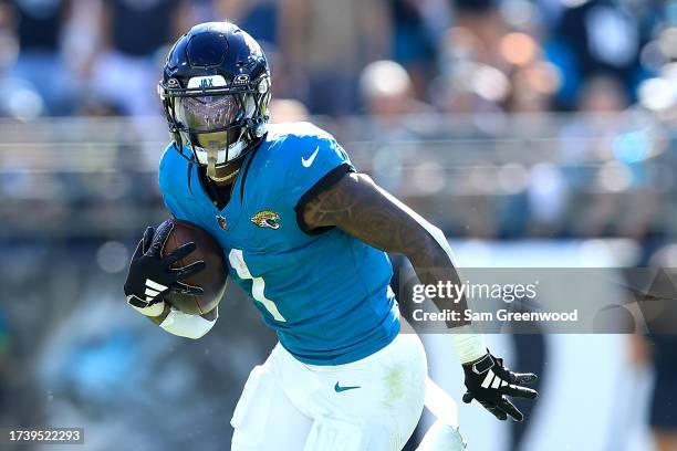 Travis Etienne Jr. #1 of the Jacksonville Jaguars runs for yardage during the game against the Indianapolis Colts at EverBank Stadium on October 15,...