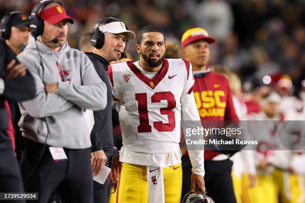Head coach Lincoln Riley of the USC Trojans talks with Caleb Williams against the Notre Dame Fighting Irish during the first half at Notre Dame...