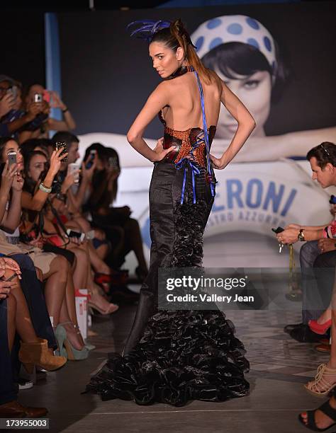 Models walks the runway during the Peroni Emerging Designer Series presented by Fashion Group on July 17, 2013 in Miami, Florida.