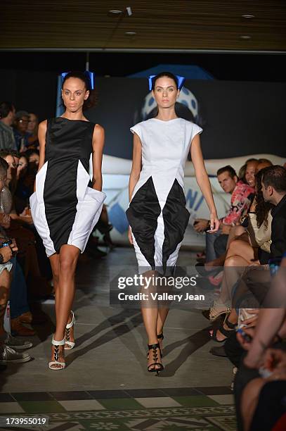 Models walks the runway during the Peroni Emerging Designer Series presented by Fashion Group on July 17, 2013 in Miami, Florida.