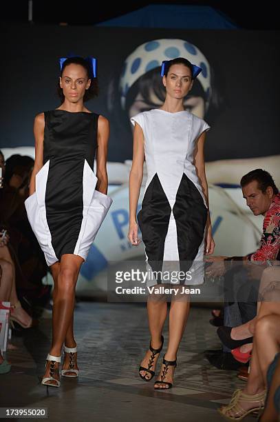 Models walks the runway during the Peroni Emerging Designer Series presented by Fashion Group on July 17, 2013 in Miami, Florida.