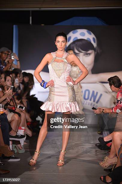 Models walks the runway during the Peroni Emerging Designer Series presented by Fashion Group on July 17, 2013 in Miami, Florida.