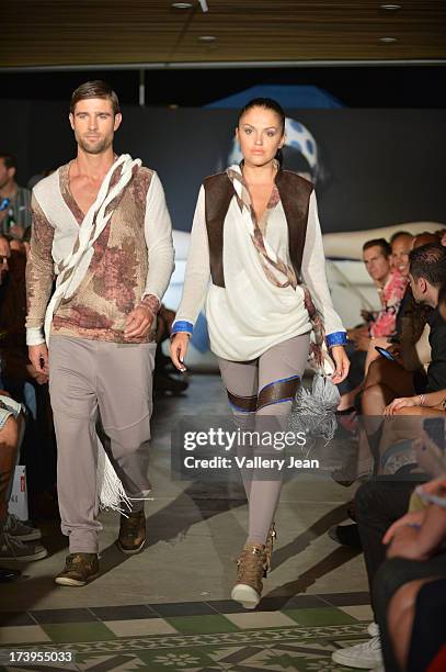 Models walks the runway during the Peroni Emerging Designer Series presented by Fashion Group on July 17, 2013 in Miami, Florida.