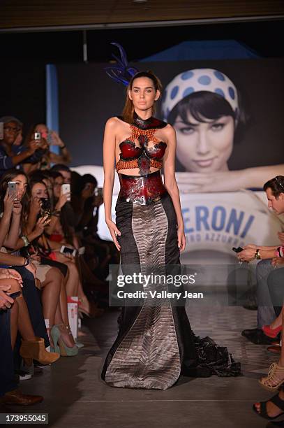 Models walks the runway during the Peroni Emerging Designer Series presented by Fashion Group on July 17, 2013 in Miami, Florida.