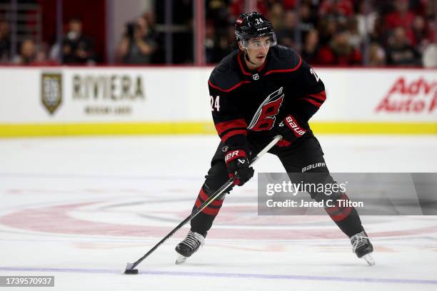 Seth Jarvis of the Carolina Hurricanes skates with the puck during the second period of their game against the Ottawa Senators at PNC Arena on...