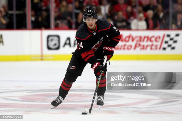 Seth Jarvis of the Carolina Hurricanes skates with the puck during the second period of their game against the Ottawa Senators at PNC Arena on...