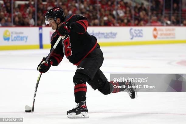Seth Jarvis of the Carolina Hurricanes attempts a shot during the second period of their game against the Ottawa Senators at PNC Arena on October 11,...