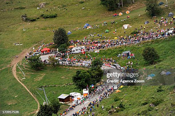 Wide view of the crowds and countryside as the peloton rides from Gap to Alpe d'Huez during Stage 18 of the Tour de France on July 18 Gap to...