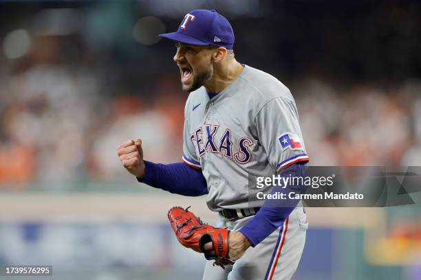 Nathan Eovaldi of the Texas Rangers celebrates an out against the Houston Astros to end the fifth inning in Game Two of the American League...