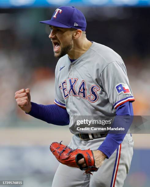 Nathan Eovaldi of the Texas Rangers celebrates an out against the Houston Astros to end the fifth inning in Game Two of the American League...