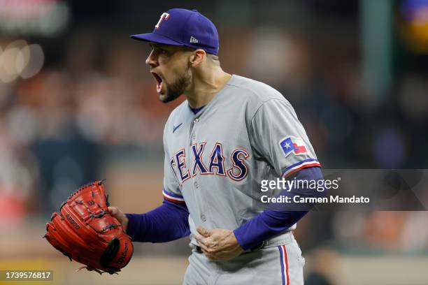 Nathan Eovaldi of the Texas Rangers celebrates an out against the Houston Astros to end the fifth inning in Game Two of the American League...