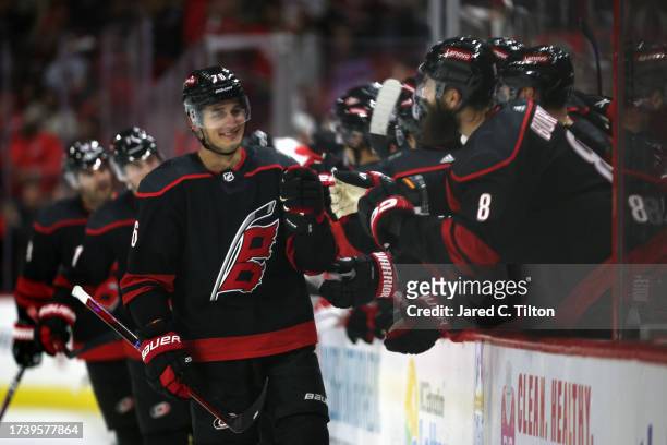 Brady Skjei of the Carolina Hurricanes reacts with his teammates after scoring a goal during the third period of their game against the Ottawa...