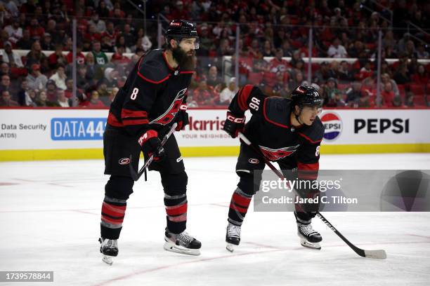 Brent Burns and Teuvo Teravainen of the Carolina Hurricanes ready for the face-off during the third period of their game against the Ottawa Senators...