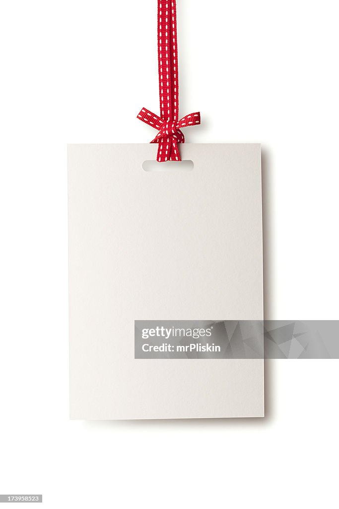 White blank card hanging from red ribbon