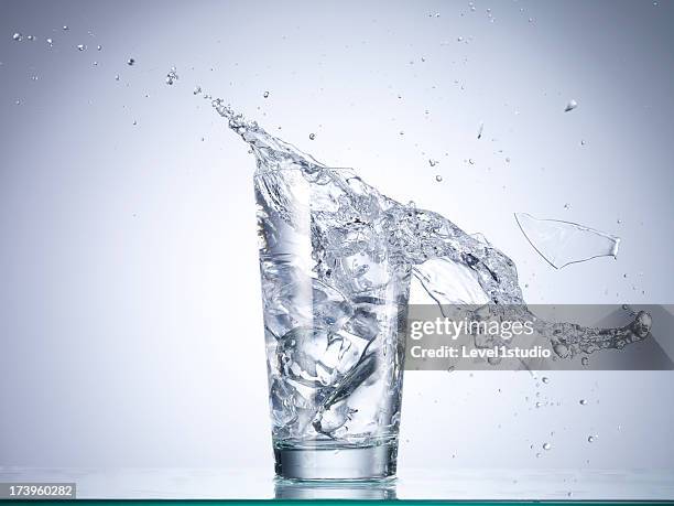 cold drink water being poured into broken glass - broken drinking glass stock pictures, royalty-free photos & images