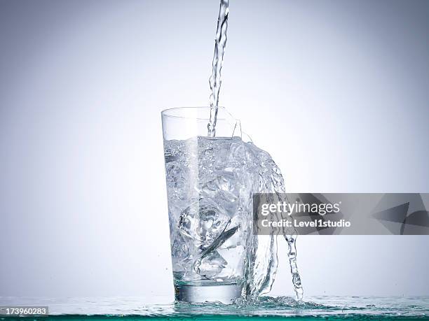 cold drink water being poured into broken glass - broken drinking glass stock pictures, royalty-free photos & images