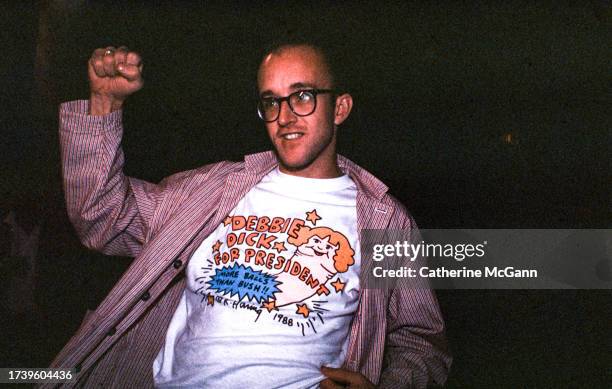 Artist Keith Haring , wearing a t-shirt of his own design which says ‘Debbie Dick For President. More Balls Than Bush’ at a nightclub in New York...