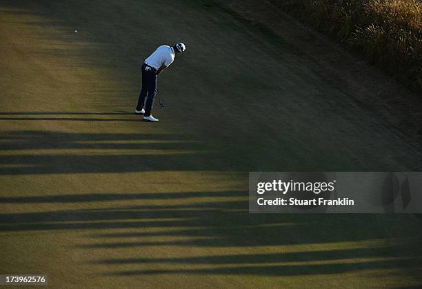 Gregory Bourdy of France putts on the 17th hole during the first round of the 142nd Open Championship at Muirfield on July 18, 2013 in Gullane,...