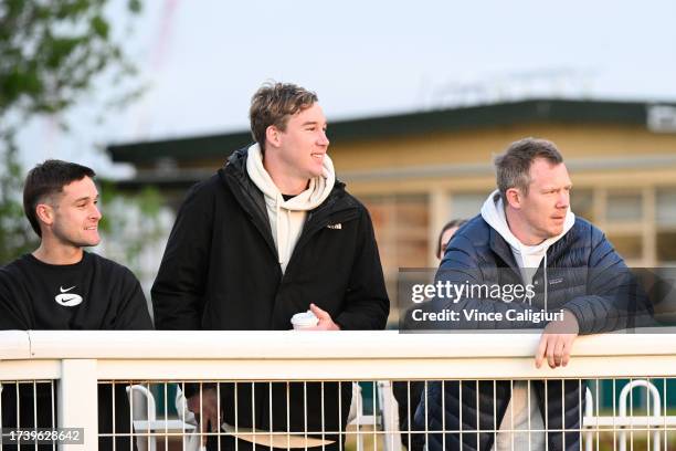 Richmond footballers and part owners Jayden Short, Tom Lynch and Jack Riewoldt watching Caulfield Cup hope Soulcombe during gallops at Caulfield...