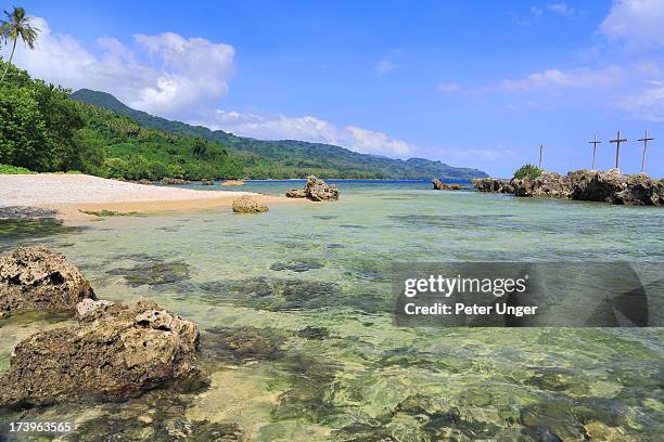 baptism rocks on coastal beach, pentecost island - baptism cross stock pictures, royalty-free photos & images