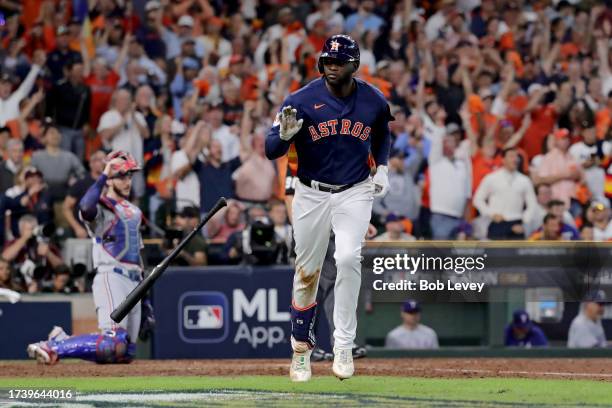 Yordan Alvarez of the Houston Astros rounds the bases after hitting a solo home run against Aroldis Chapman of the Texas Rangers during the eighth...