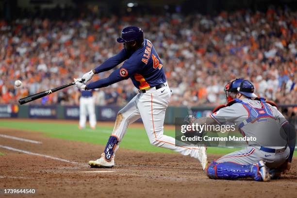 Yordan Alvarez of the Houston Astros hits a solo home run against Aroldis Chapman of the Texas Rangers during the eighth inning in Game Two of the...