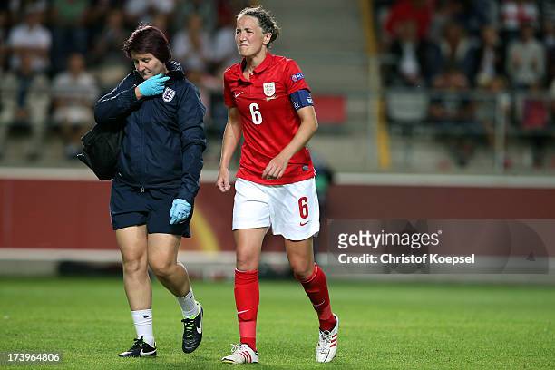 Casey Stoney of England walks off the pitch injured during the UEFA Women's EURO 2013 Group C match between France and England at Linkoping Arena on...