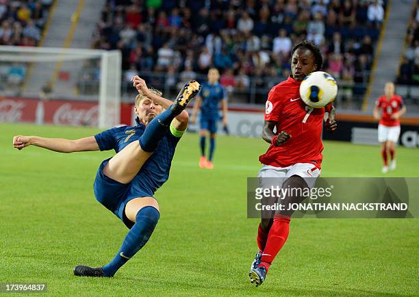 France's defender Corine Franco and England's forward Eniola Aluko vie for the ball during the UEFA Women's European Championship Euro 2013 group C...