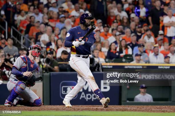 Yordan Alvarez of the Houston Astros hits a solo home run against Aroldis Chapman of the Texas Rangers during the eighth inning in Game Two of the...